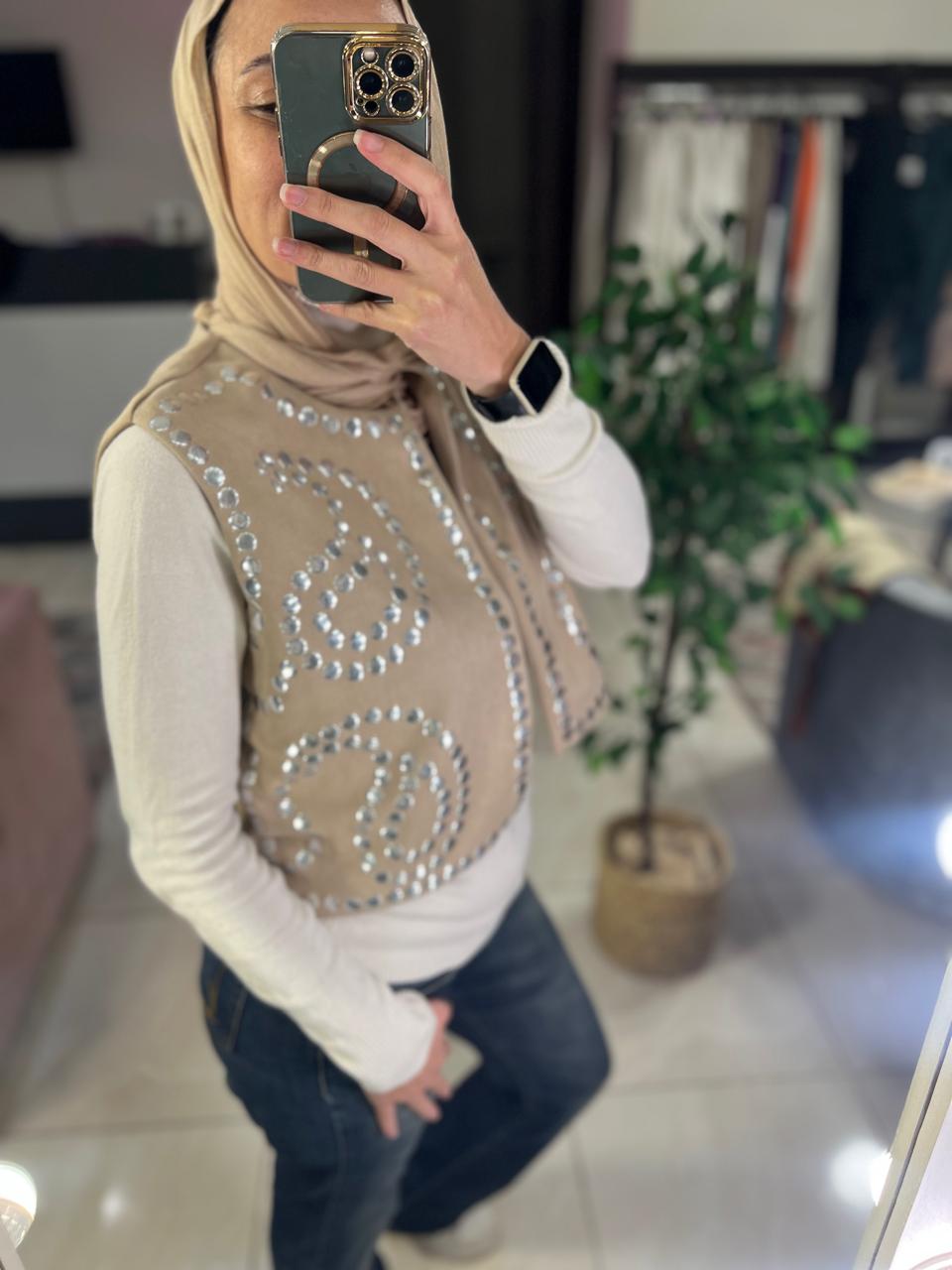 Beige suede vest with studs