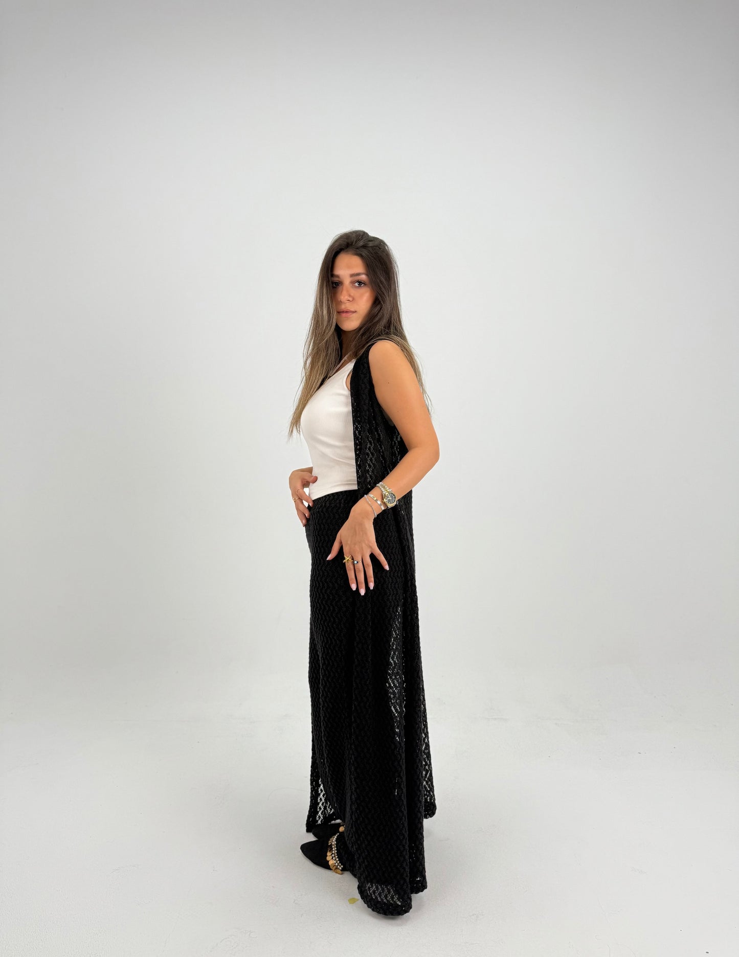 Hooded crochet long vest in black With knitted pants 
