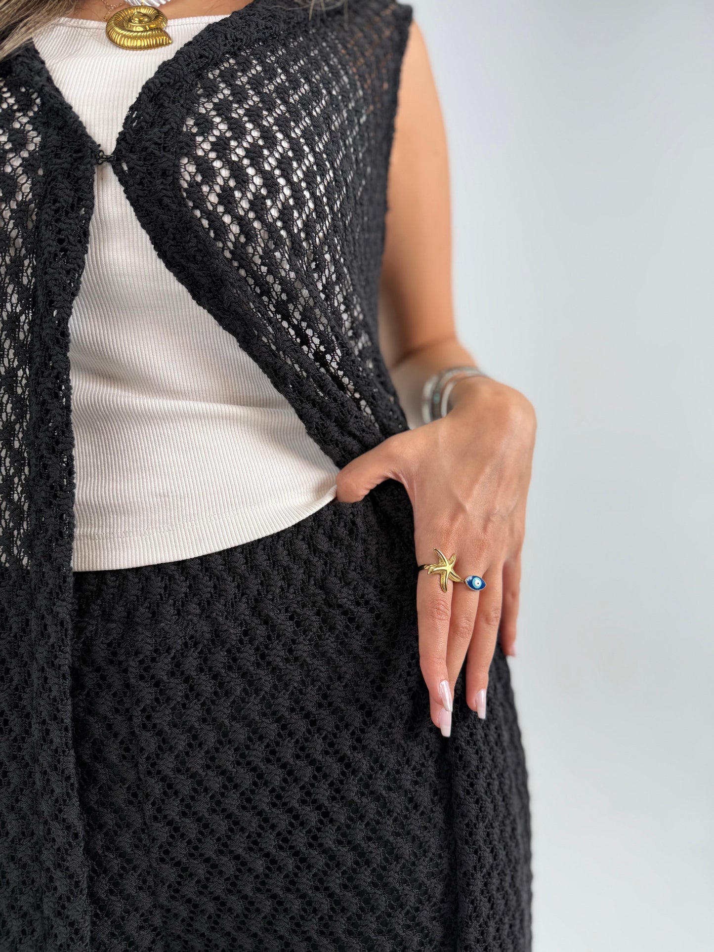 Hooded crochet long vest in black With knitted pants 